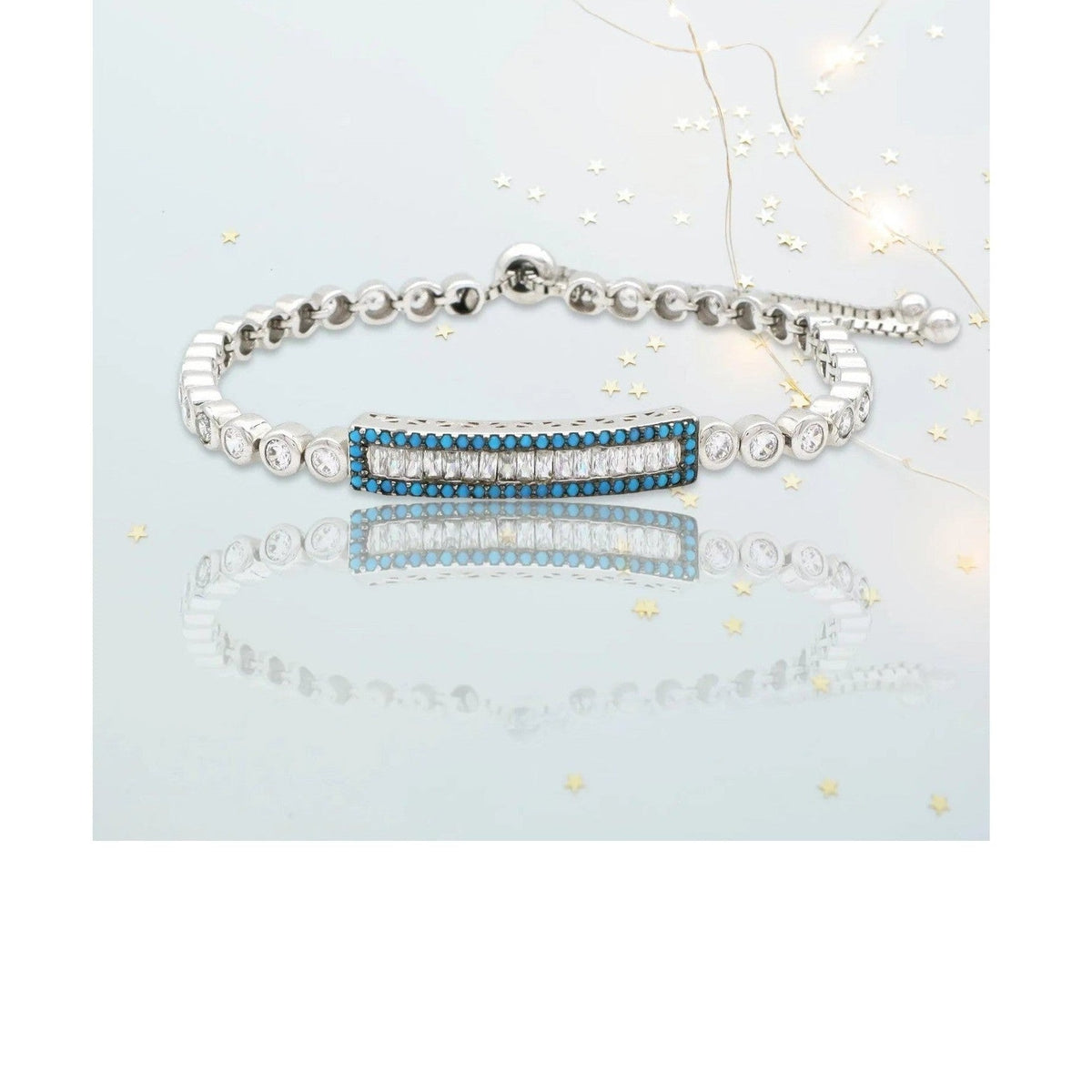 Soteria adjustable rhodium bracelet featuring baguette clear stone bar charm and beaded chain