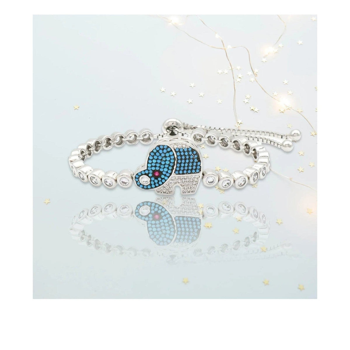 Soteria adjustable rhodium bracelet with blue micro-pave elephant charm and zirconia accents
