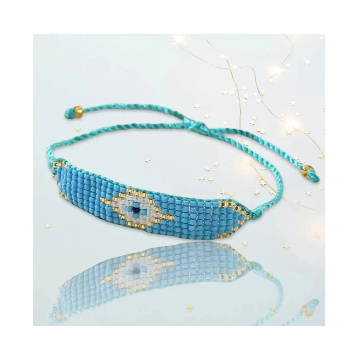 Turquoise Miyuki bead bracelet featuring evil eye motif and gold accents