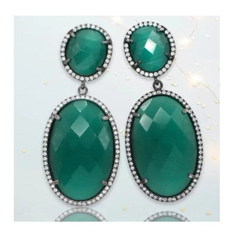 Hermione gunmetal dangling crystal earrings with green oval stones