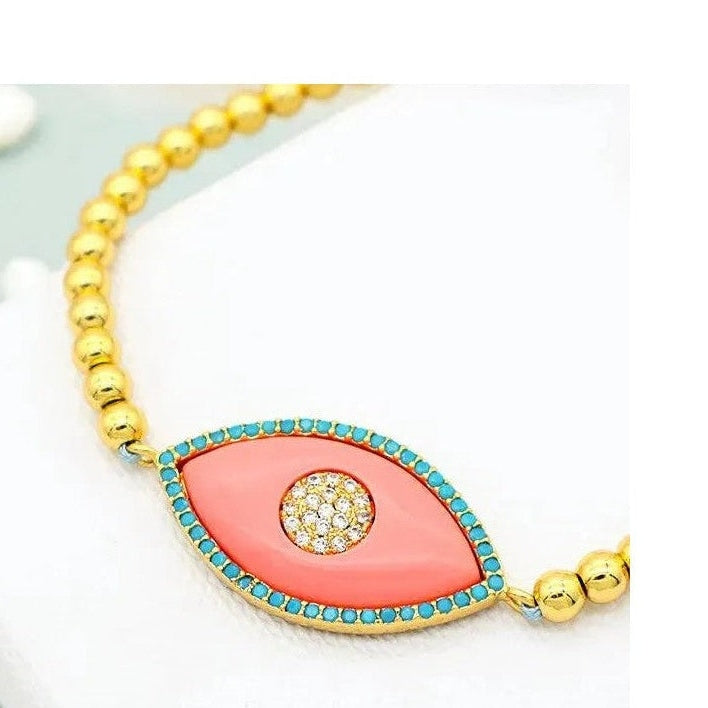 Gold plated marquis evil eye bracelet with coral body and turquoise stones