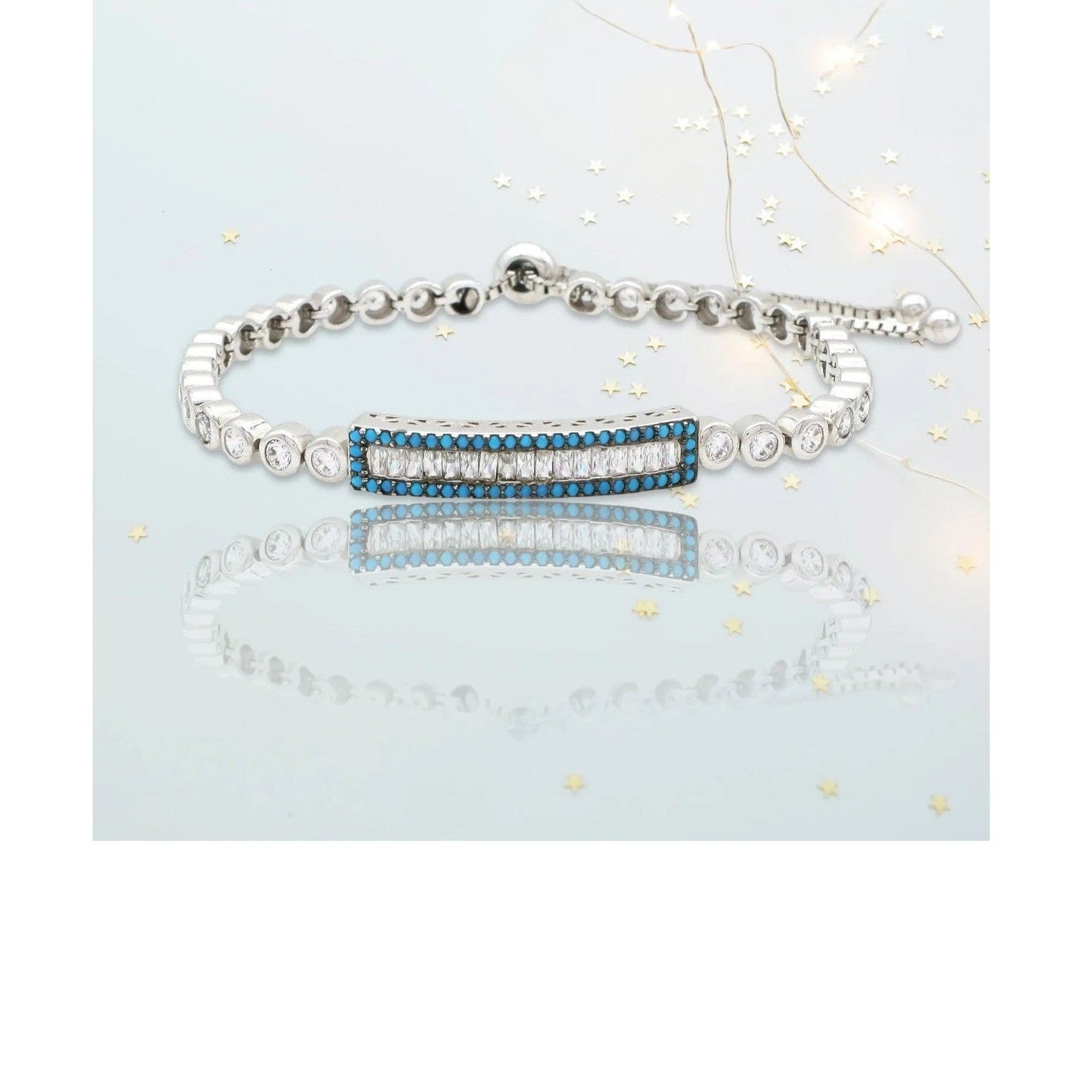 Soteria adjustable rhodium bracelet featuring baguette clear stone bar charm and beaded chain