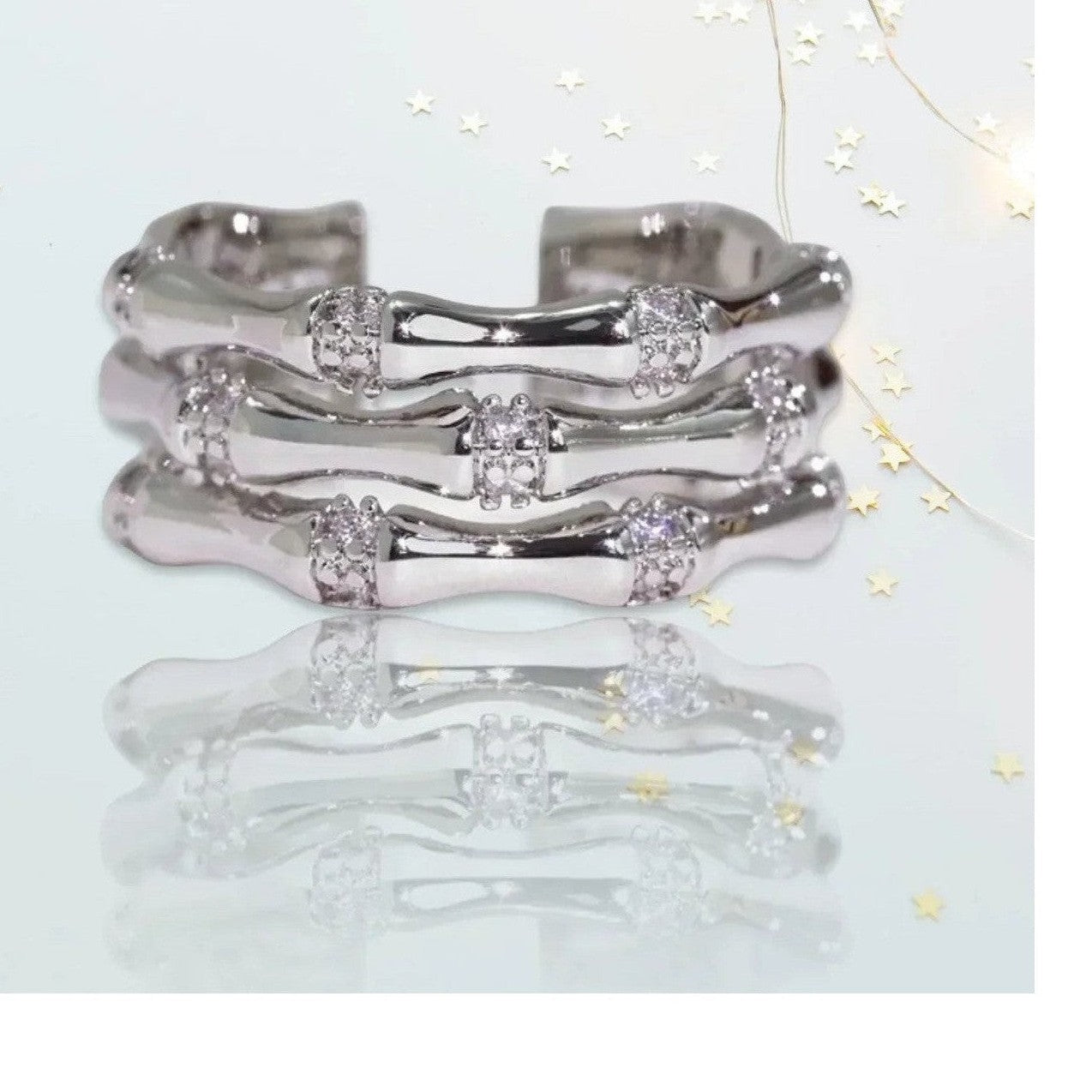 Set of three silver bone-segment rings with crystal connection points