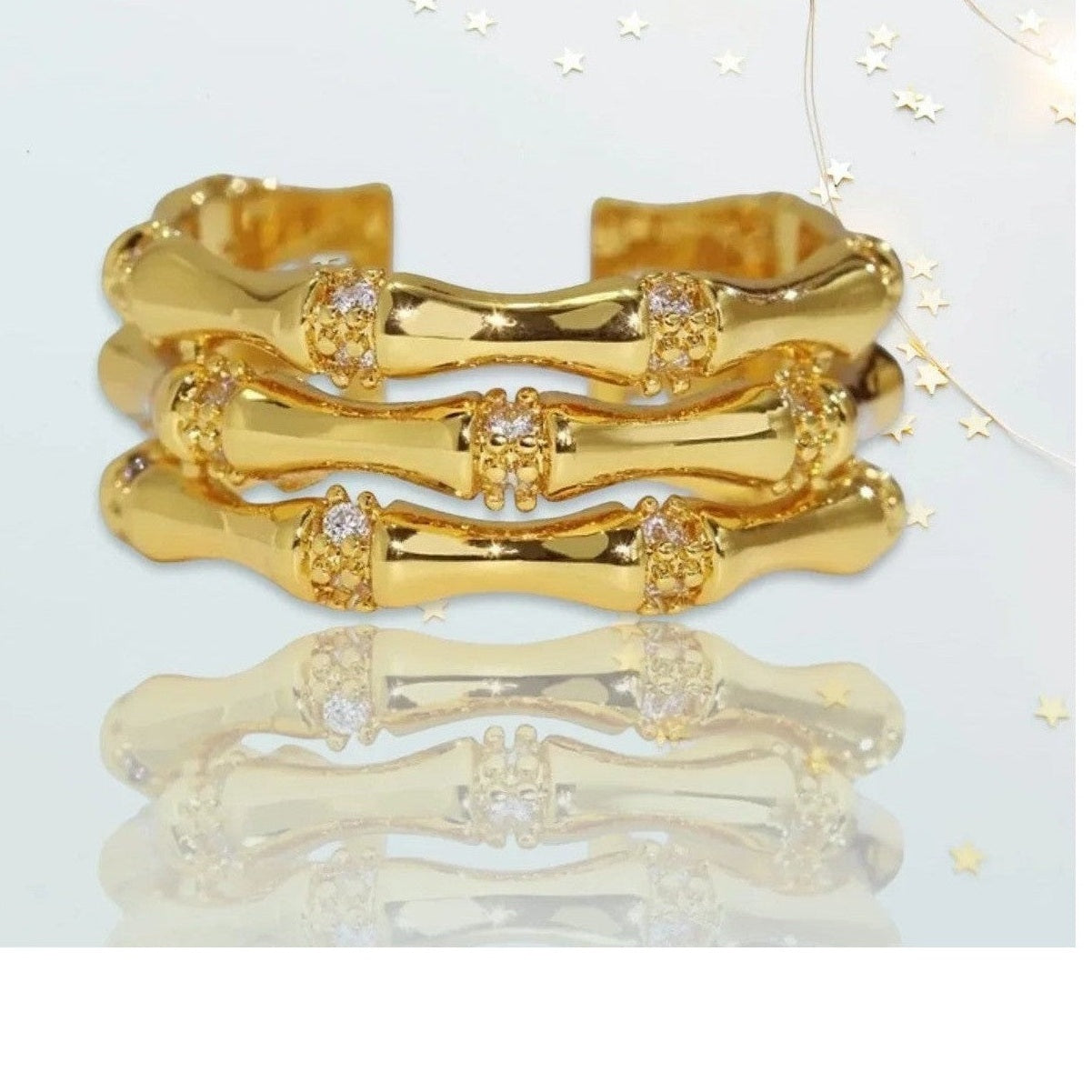 Set of three bone-segment adjustable rings with crystal joint details
