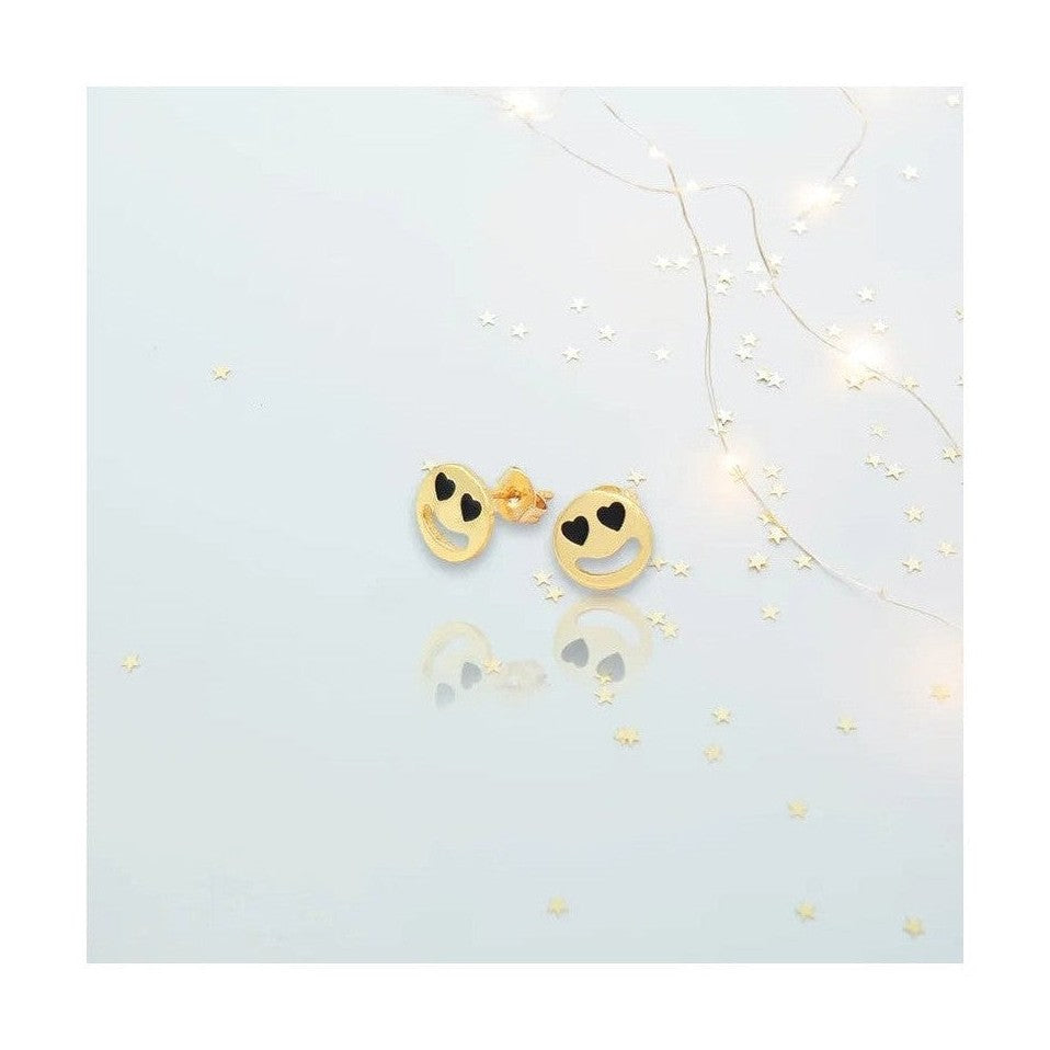 Smiley face stud earrings with black heart eyes