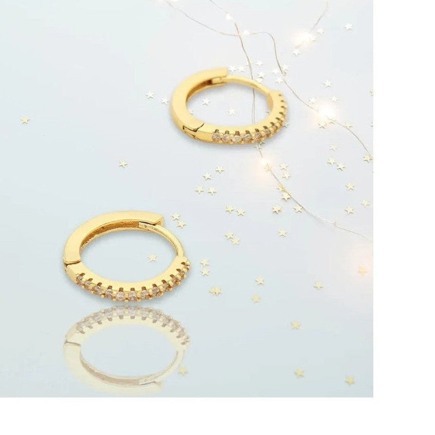 Gold-tone huggie hoop earrings with clear stones